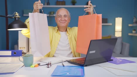 Home-office-worker-old-man-doing-online-shopping.